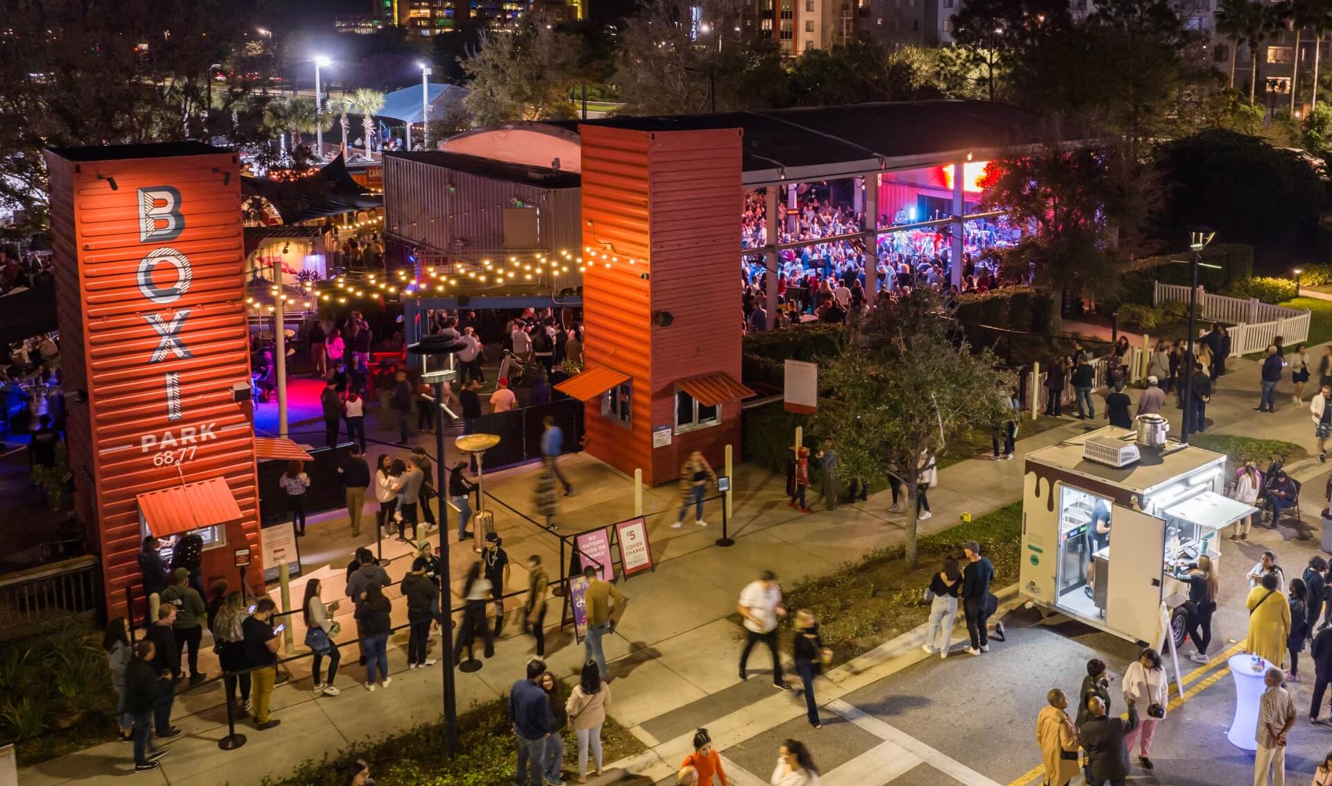 Boxi Park outdoor container-park venue at night with live music and crowd