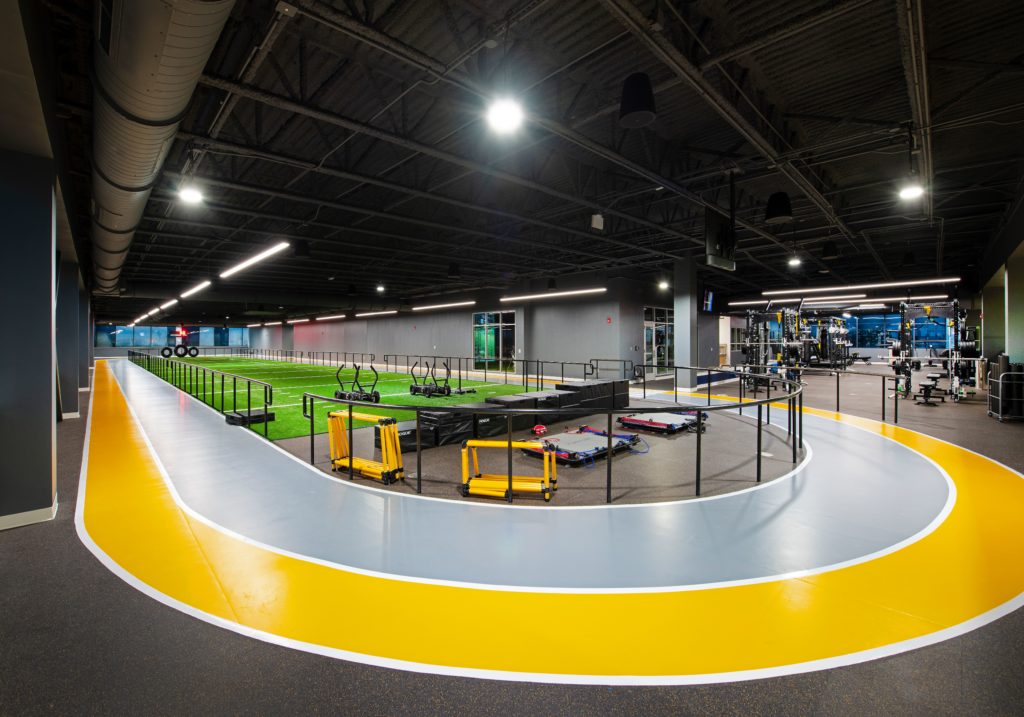 Indoor running track and turf training area at Lake Nona Performance Club